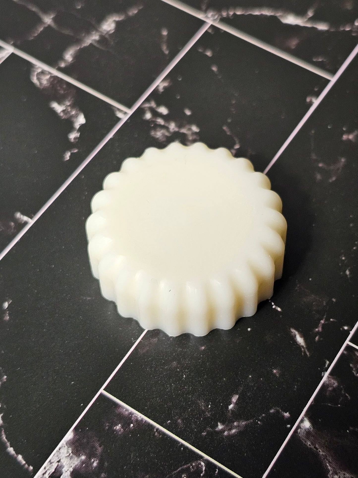 Wax melt on a dark marble background