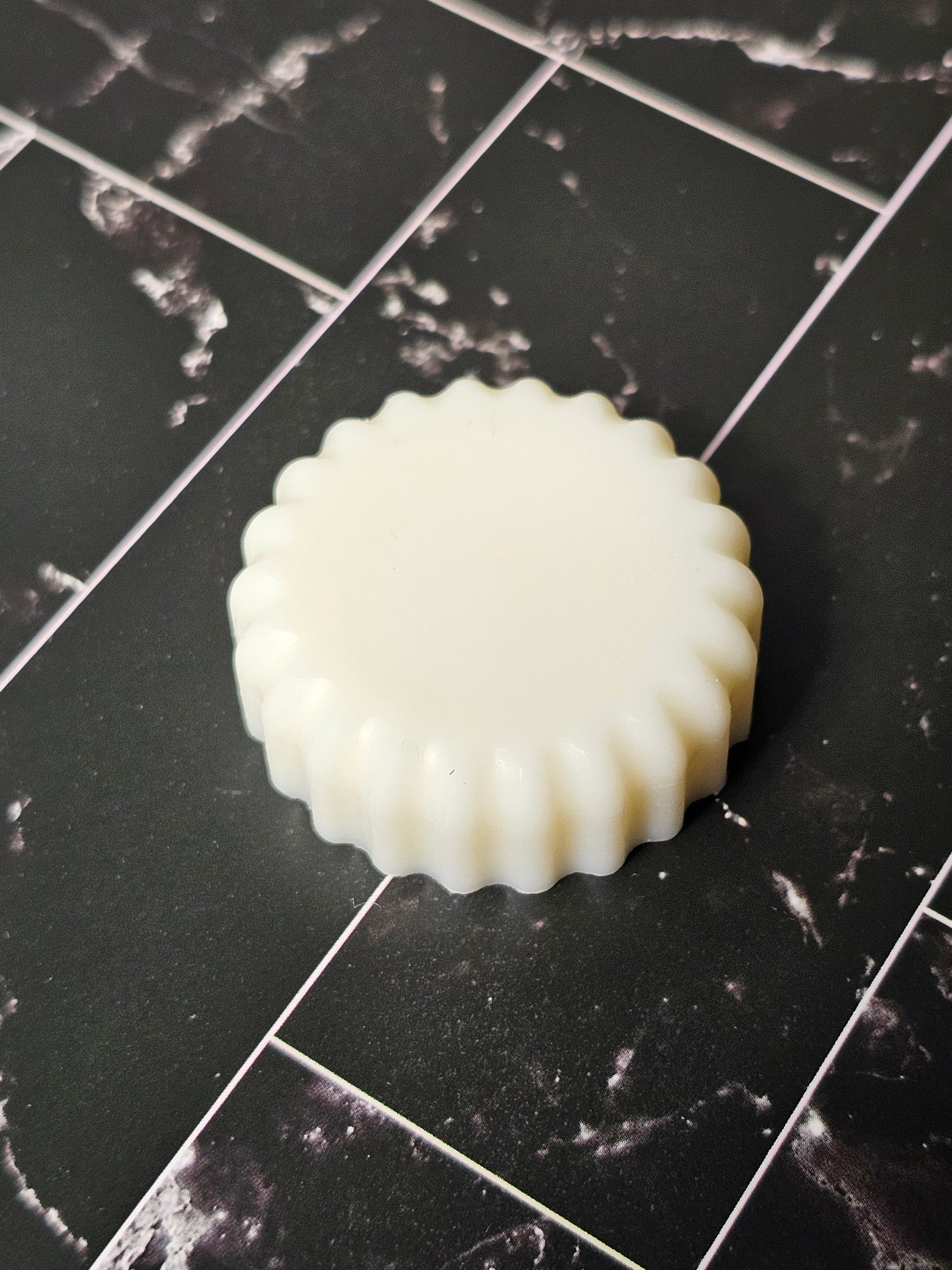 Wax melt on a dark marble background